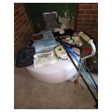 Box of health-related items: canes, foam cushion,