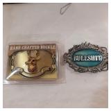 2 belt buckles 1 deer and 1 bullshit