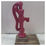 Water pump sculpture for putting plant under