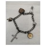 Silver charm bracelet Marked Sterling.   600oz