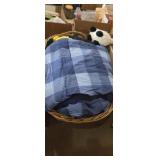 Woven laundry basket , blankets and stuffed