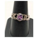 Silver purple stone X ring marked 925 size 8.