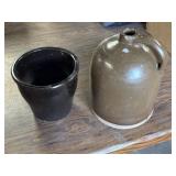 Stoneware dark glazed pot and a brown slip-glazed