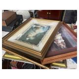 Various art prints in ornate frames