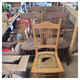 5 wood chairs 4 matching and 1 leather seat all