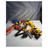 Assortment of construction vehicles and semis,