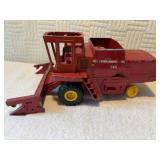 760 Massey Ferguson combine missing one wheel on