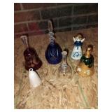 Group of decorative glass and ceramic bells.