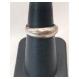 Silver band marked  925 size 6.   .090oz