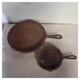 2 unmarked cast iron skillets 6.5in and 10in