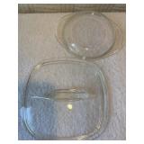 2 Pyrex lids one 9-9, other 9-7.