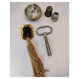 Clock key ,meter, sewing thimble, tastle