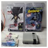 Black Adam and batman figures and comic books,