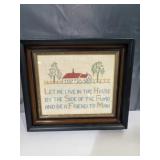 v framed cross-stitch sampler featuring the
