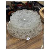 Clear glass plates, relish trays, and deviled egg