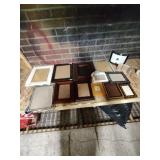 Large group of photo frames, assorted sizes.