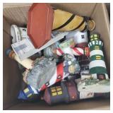 Box of assorted lighthouse decor.