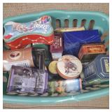 Laundry basket full of metal tins.
