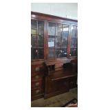 Dark wooden secretary bookcase with display top