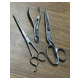 3 polished stainless steel grooming tools