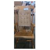 Wooden armed rocking chair