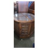 Ornate round top side table with storage