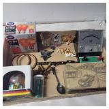 Red light bulb, small porcelain camels, dice and