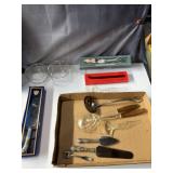 silver serving utensils, clear spoon and