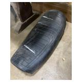 BMW black vinyl motorcycle saddle features a