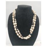 white/gold and white/black strand necklaces