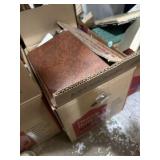 Box filled with cookbooks, recipe books and more