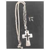 cross necklace marked 1946 and pierced earrings