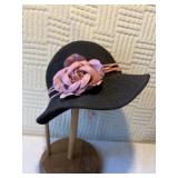 Two ladies black dress hats.