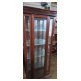 Lighted curio cabinet with glass shelfs