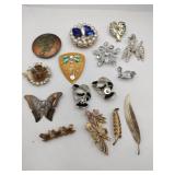 Different style brooches flowers leaves animals