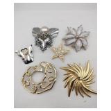 Gold and silver brooches