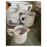4 stoneware measuring pitchers