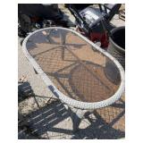 wicker oval patio coffee table features an inset