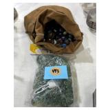 Marbles and shooters in pouch and new marbles and
