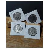 4 COLLCTABLE KENNEDY HALF DOLLARSWITH KEY DATES