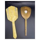 Two vintage hand held Lady mirrors.