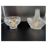 Two candle holders one one is a basket style.