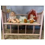 Pink doll bed 17 1/2 x 22 two dolls and pillow.