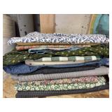 Different sizes of fabric, some quilted style,