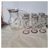 Glass painted Christmas pitcher and wine glasses