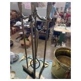 Brass fireplace tools on stand