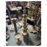 4 brass candleholders ranging from 5 inch to 18