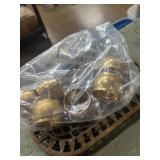 Set of six hammered brass napping rings and brass