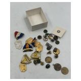 Various badges, lapel pins, ribbons, and small