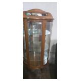 Lighted curved glass curio cabinet with key